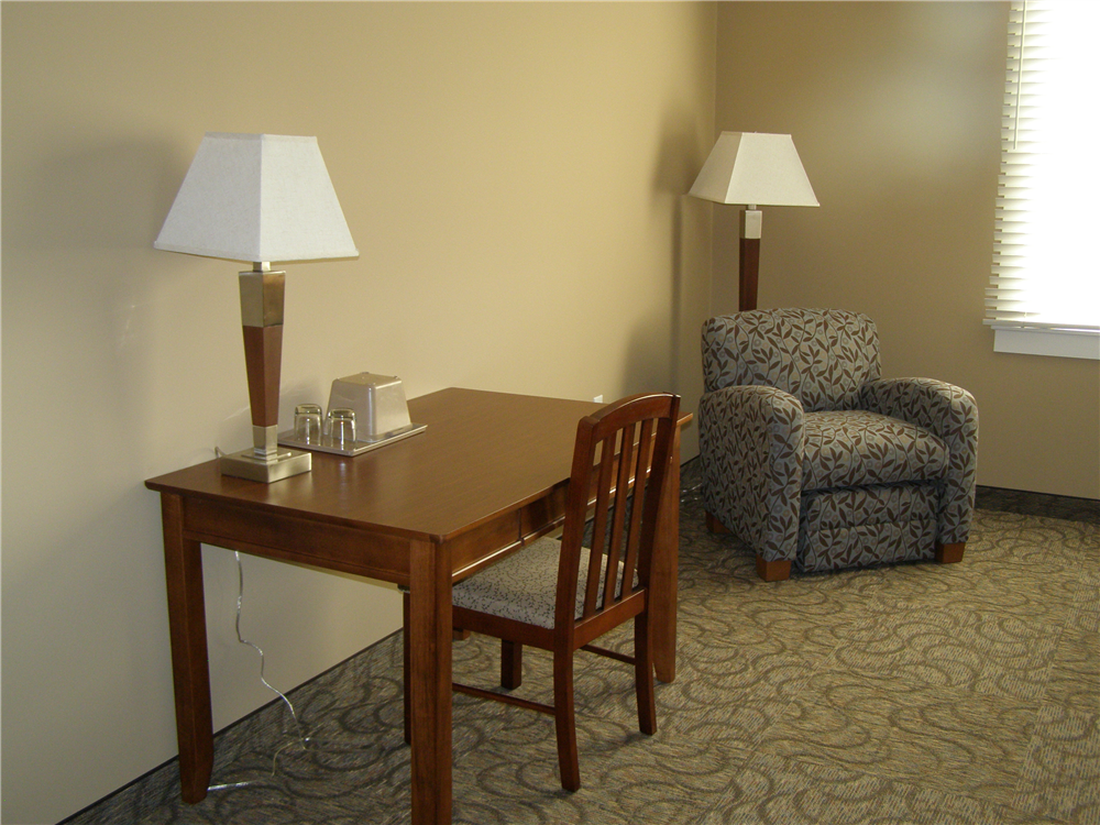 Each room also features a desk and easy chair.